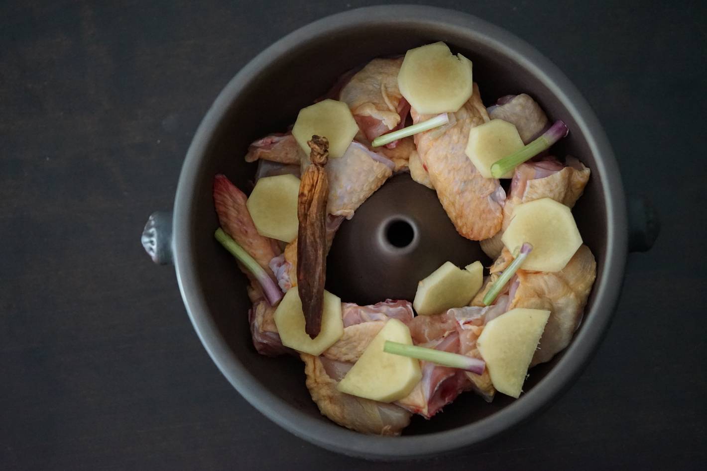 Adding ingredients inside the pot